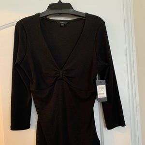 Brand new Guess top with tags never worn.